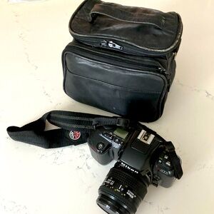 Nikon N6006 AF camera with lenses and leather bag.
